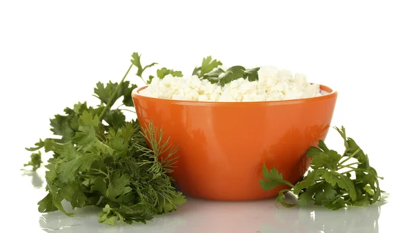 Cottage cheese with parsley and dill in orange bowl isolated on white — Stock Photo, Image