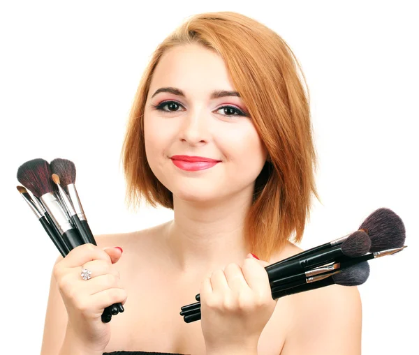 Portret van mooie vrouw met make-up borstels — Stockfoto