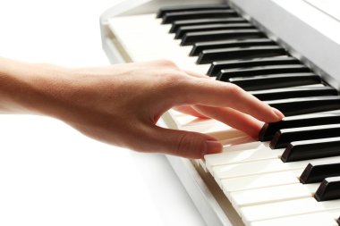 Hand of woman playing synthesizer clipart