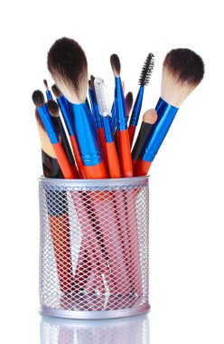 Make-up brushes in holder isolated on white