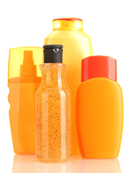Botellas con crema bronceadora aislada en blanco — Foto de Stock