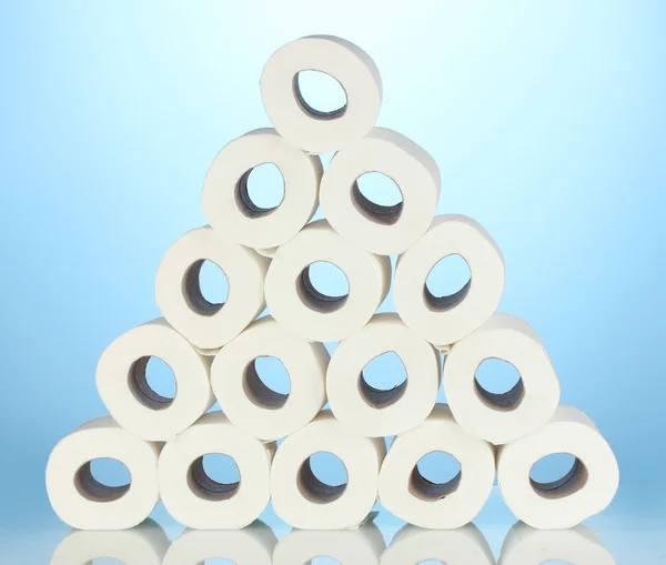 Rolls of toilet paper on blue background — Stock Photo, Image