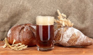 Glass of kvass with bread on canvas background close-up clipart