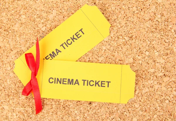 Cork board with cinema tickets — Stock Photo, Image
