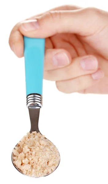 Brązowy cukier w metalową łyżką na białym tle — Zdjęcie stockowe