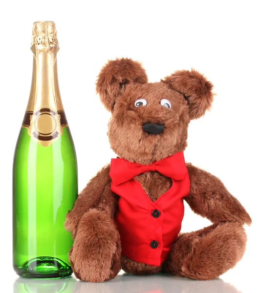Toy bear and bottle of champagne isolated on white — Stock Photo, Image