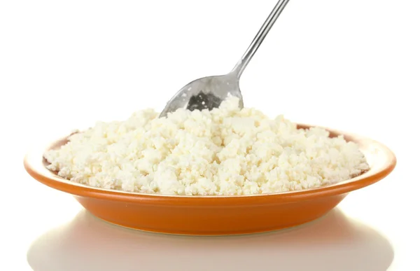 Spoon scoops of cottage cheese in a plate on white background — Stock Photo, Image