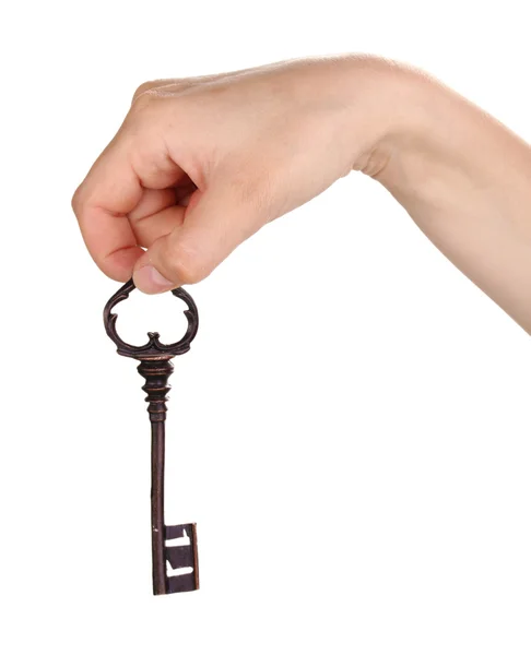 Ženská ruka držící starožitný klíč na bílém pozadí — Stock fotografie