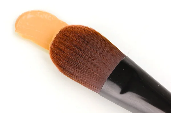 Cosmetic liquid foundation and brush isolated on white — Stock Photo, Image