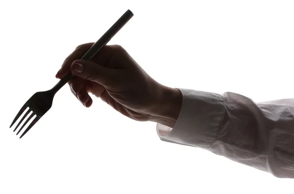 Silueta de la mano de la mujer con tenedor aislado en blanco —  Fotos de Stock
