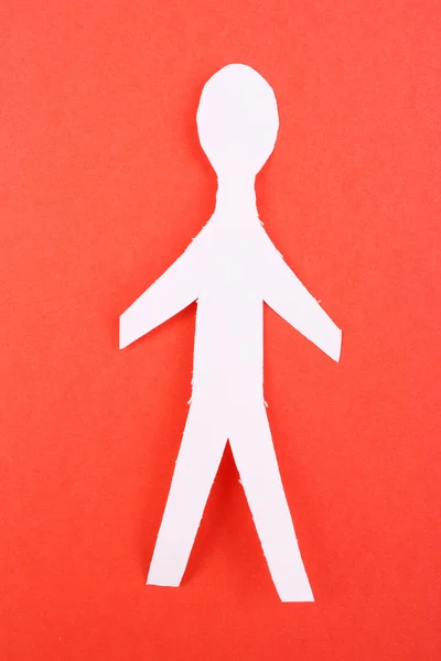 Homem de papel no fundo vermelho — Fotografia de Stock