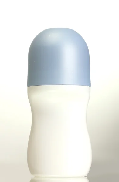 Desodorante sobre fondo azul — Stok fotoğraf