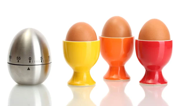 Temporizador de huevo y huevo en soporte de color aislado en blanco —  Fotos de Stock