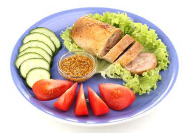 Tasty meat cutlet with garnish on plate isolated on white