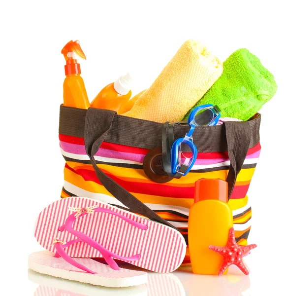 Beach bag with beach accessories, isolated on white — Stock Photo, Image