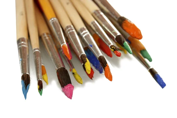 Paint brushes with gouache isolated on white — Stock Photo, Image