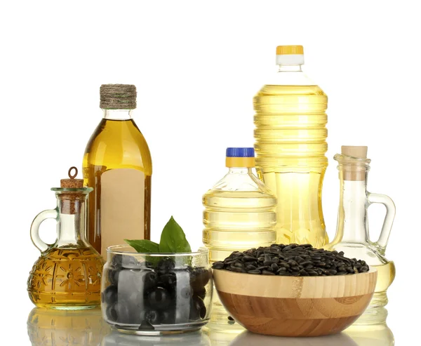 Azeite e óleo de girassol nas garrafas e pequenos decantadores isolados em branco — Fotografia de Stock
