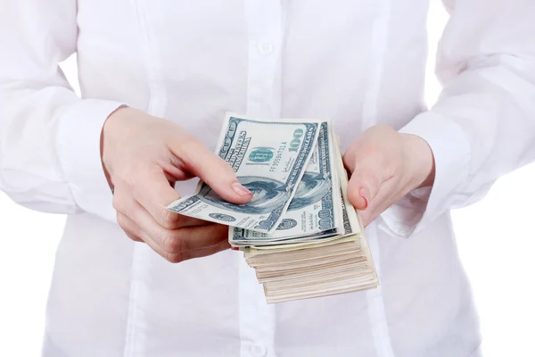 Dólares americanos em uma mulher mãos em um fundo branco — Fotografia de Stock
