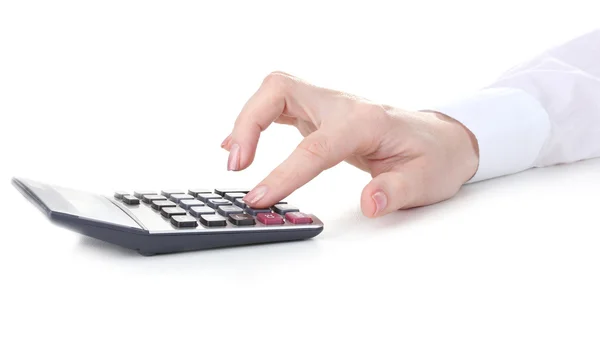 Vrouwen hand en rekenmachine geïsoleerd op wit — Stockfoto