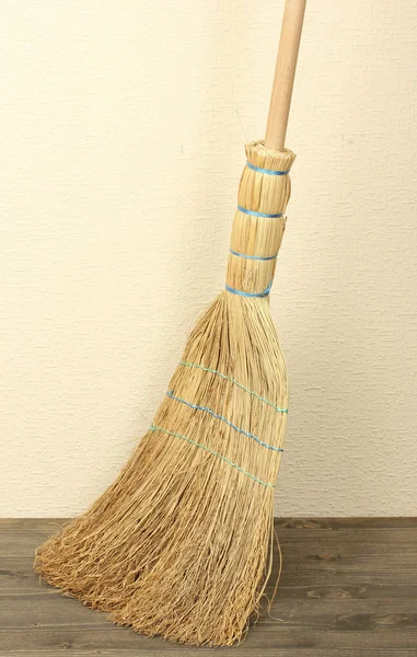 Broom on floor in room — Stock Photo, Image