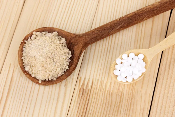 stock image Sweetener and brown sugar in spoons on wooden background