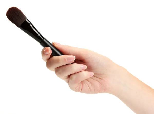 Mão com escova preta para maquiagem isolada em branco — Fotografia de Stock