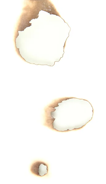 Agujeros quemados en papel blanco aislados en blanco —  Fotos de Stock