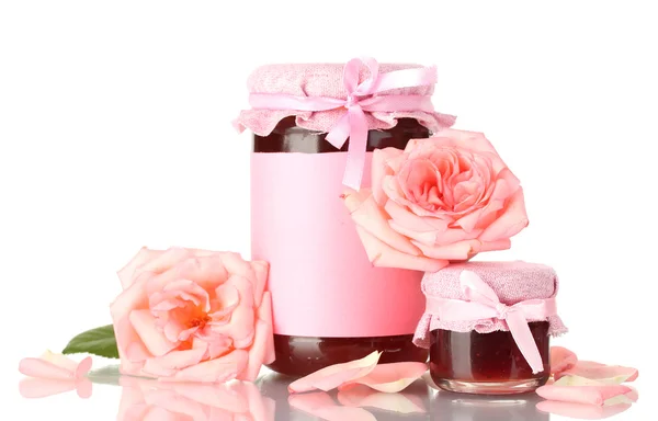 Jars with rose jam and flowers isolated on white — Stock Photo, Image