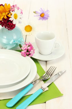 Beautiful holiday table setting with flowers clipart