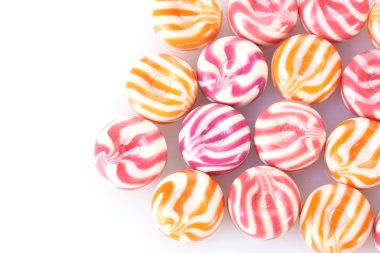 Striped fruit candies isolated on white clipart