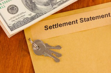 Folder with the settlement statement on wooden background close-up clipart