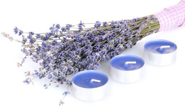 Lavender flowers and candles isolated on white