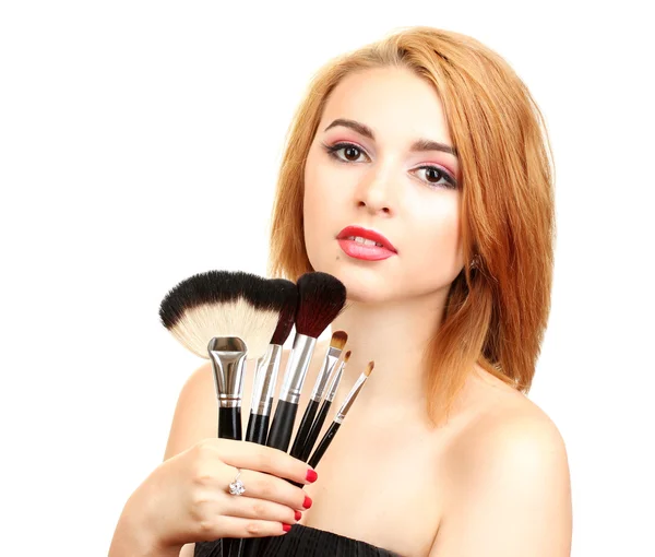 Portret van mooie vrouw met make-up borstels — Stockfoto
