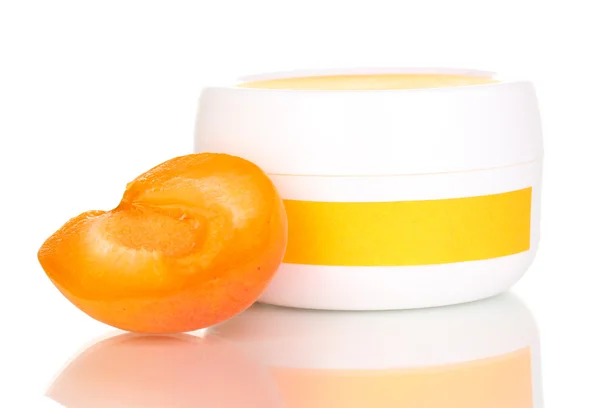 Jar of cream with juicy apricot isolated on white — Stock Photo, Image