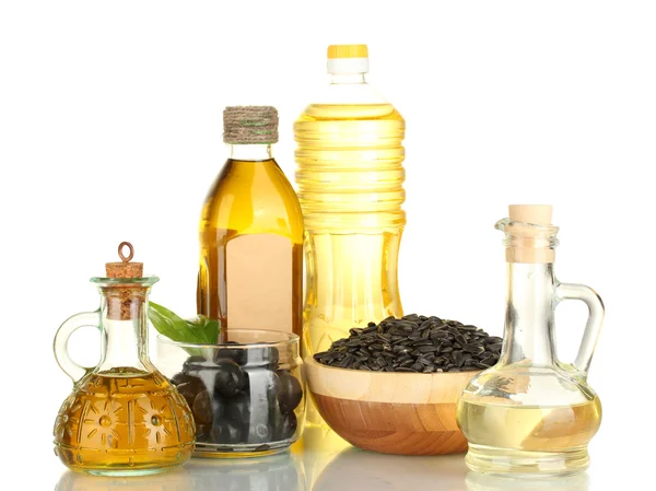 A palackok és a kis, elszigetelt fehér gyűjtő hordókkal olíva és napraforgó olaj — Stock Fotó