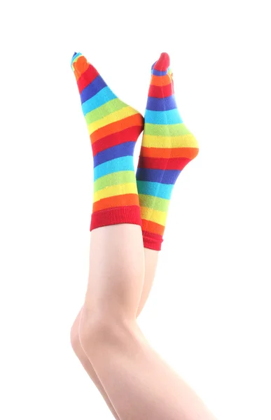 Kobiece nogi w kolorowe paski, skarpety na białym tle — Zdjęcie stockowe