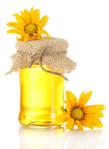 Γλυκό μέλι σε βάζο και λουλούδια που απομονώνονται σε λευκό — Φωτογραφία Αρχείου