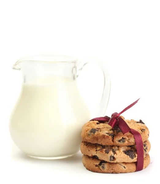 Jar of milk and chocolate chips cookies with red ribbon isolated on white — Stock Photo, Image