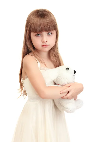 Porträtt av vacker söt flicka med leksak kanin isolerad på vit — Stockfoto
