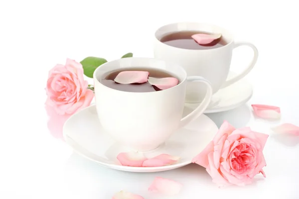 Cups of tea with roses isolated on white — Stock Photo, Image