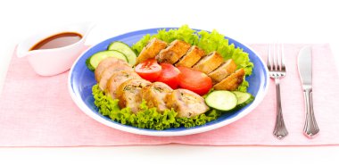 Tasty meat cutlet with garnish on plate isolated on white