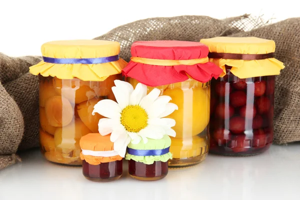 Jar with canned fruit on canvas background close-up — Stock Photo, Image