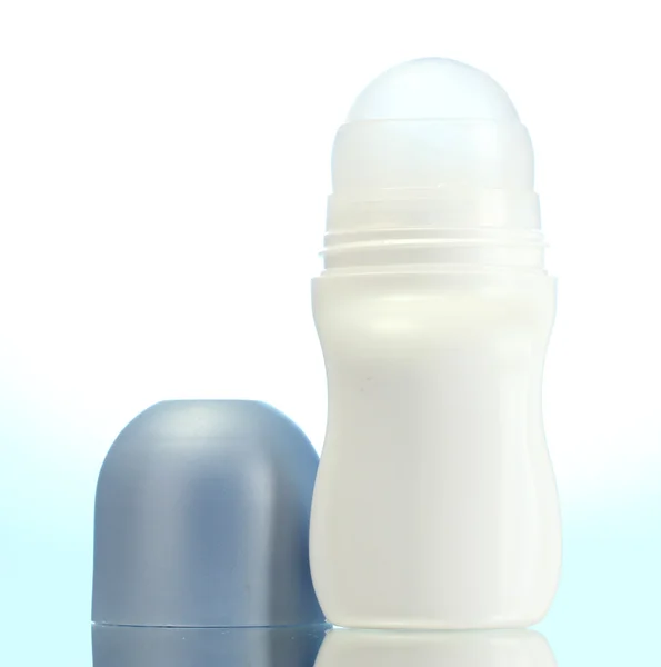 Deodorant on blue background — Stock Photo, Image