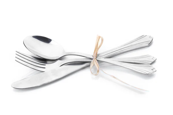 Tenedor de plata, cuchara y cuchillo atado con cinta aislada en blanco —  Fotos de Stock