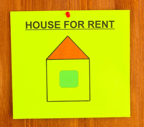 Ahşap zemin üzerinde ev kiralama hakkında poster — Stok fotoğraf