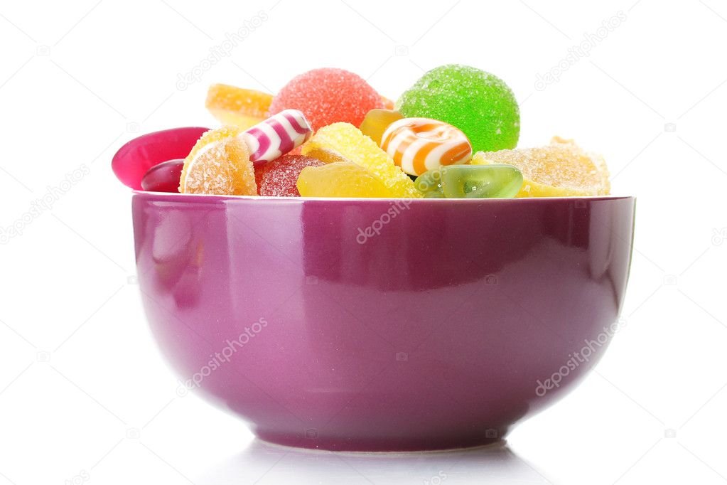 Colorful jelly candies in purple bowl isolated on white