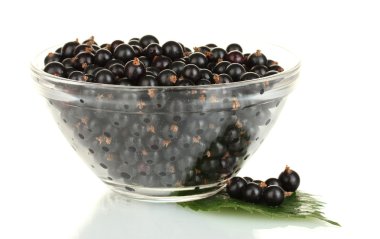 Fresh black currant in transparent bowl isolated on white