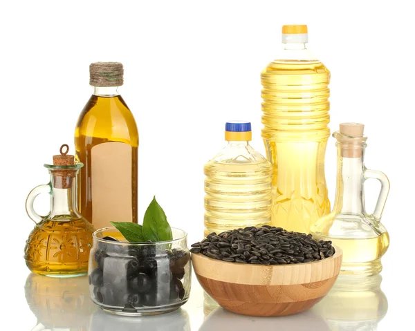 Azeite e óleo de girassol nas garrafas e pequenos decantadores isolados em branco — Fotografia de Stock