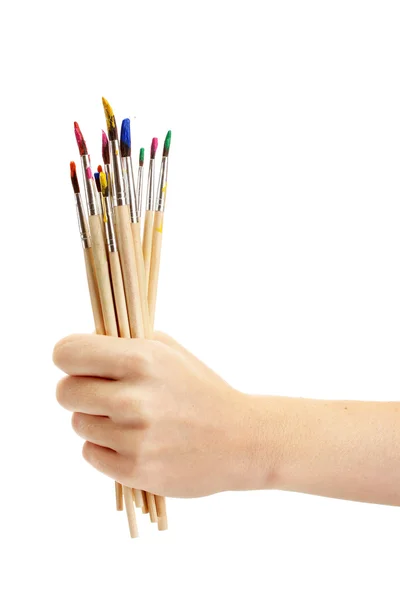 Mão com escovas isoladas em branco — Fotografia de Stock