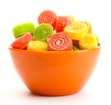 Colorful jelly candies in bowl isolated on white clipart